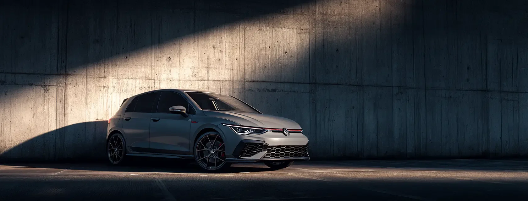 A sleek grey Volkswagen Golf GTI hatchback parked